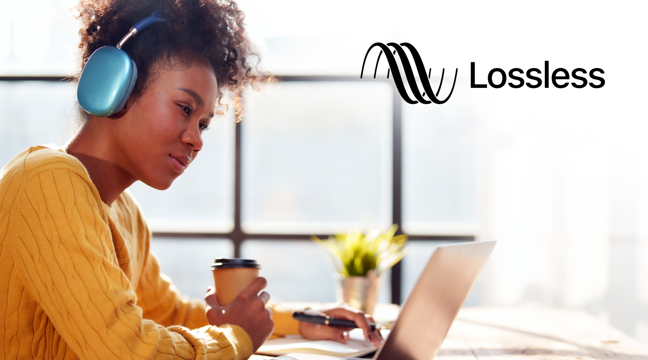 Woman with headphones listening to Lossless audio.