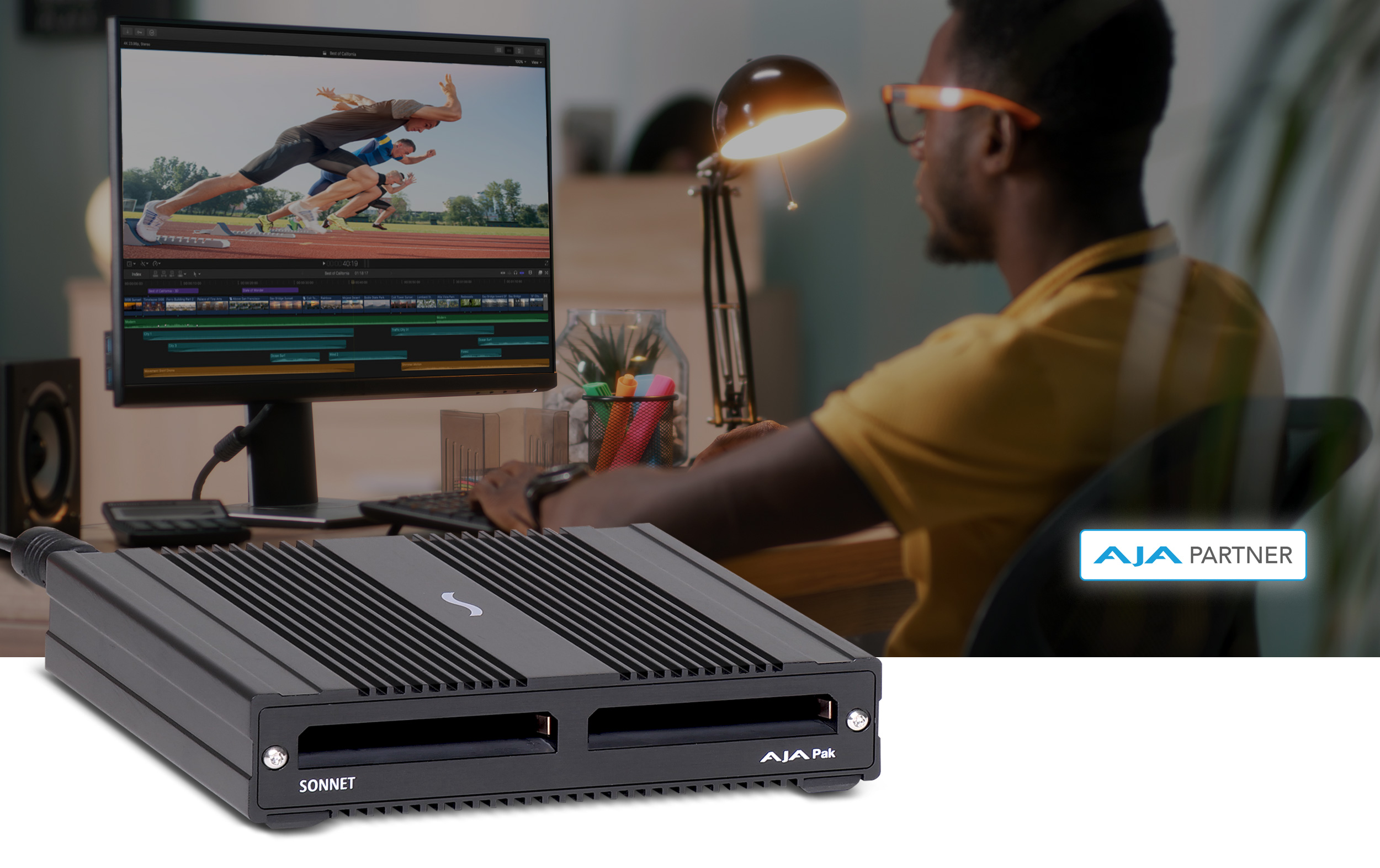 SF3 Series - AJA PAK Media Pro Card Reader with video editor in the background.
