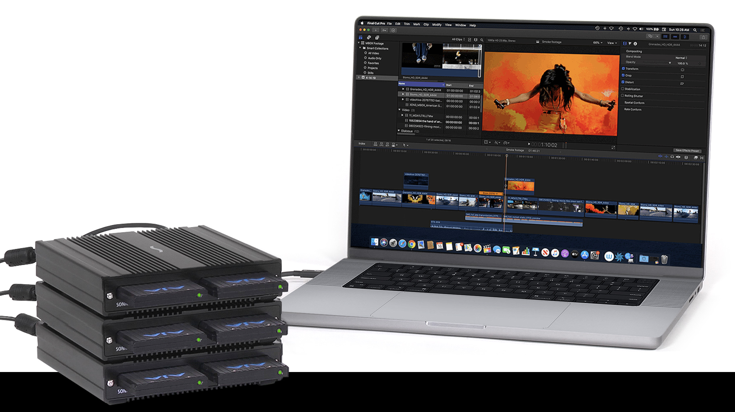 Three AJA PAK Media Pro Card Readers Stacked Together Next to a MacBook Pro