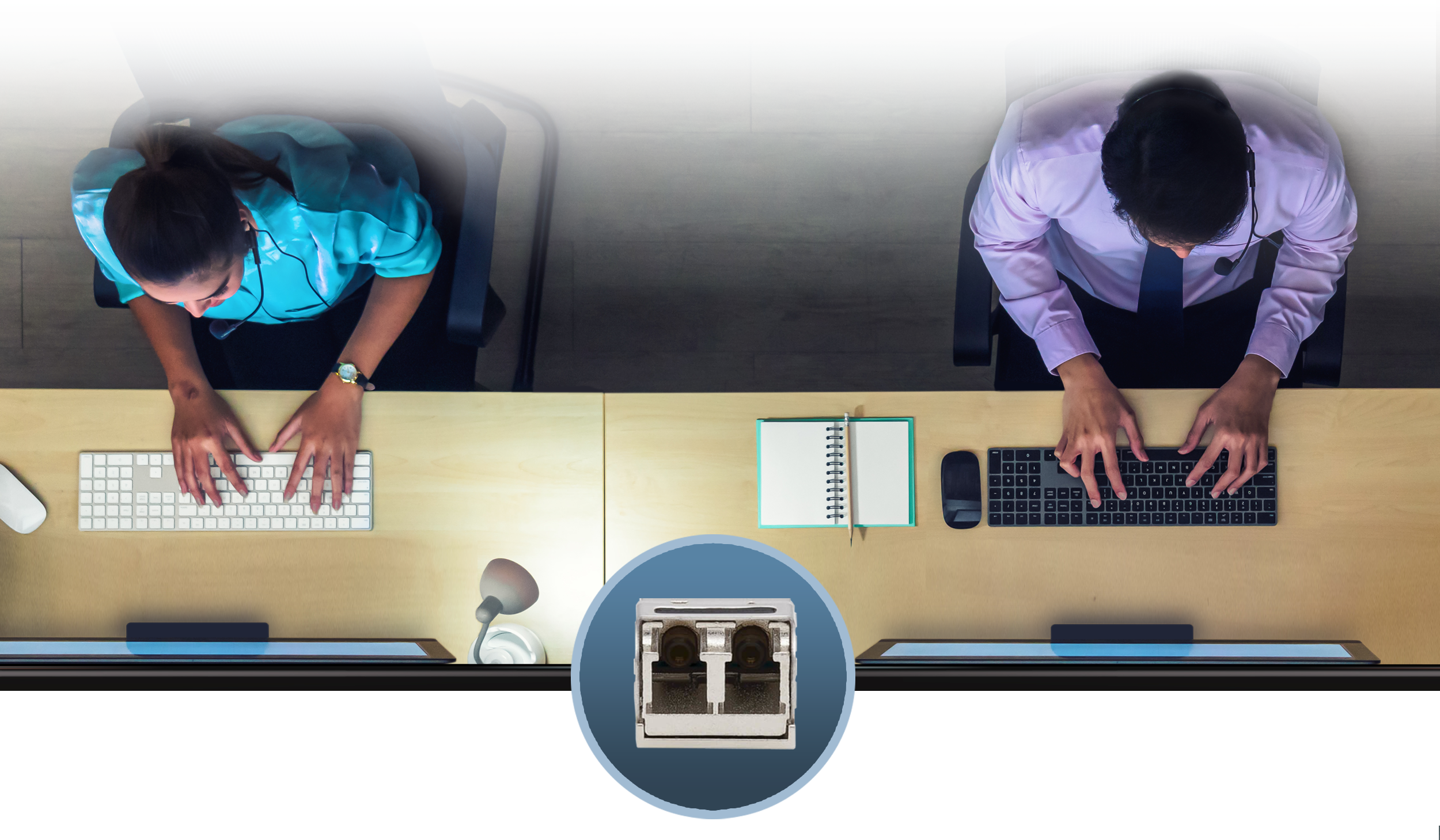 Two office workers sitting behind computers with a 10GbE optical network port shown.