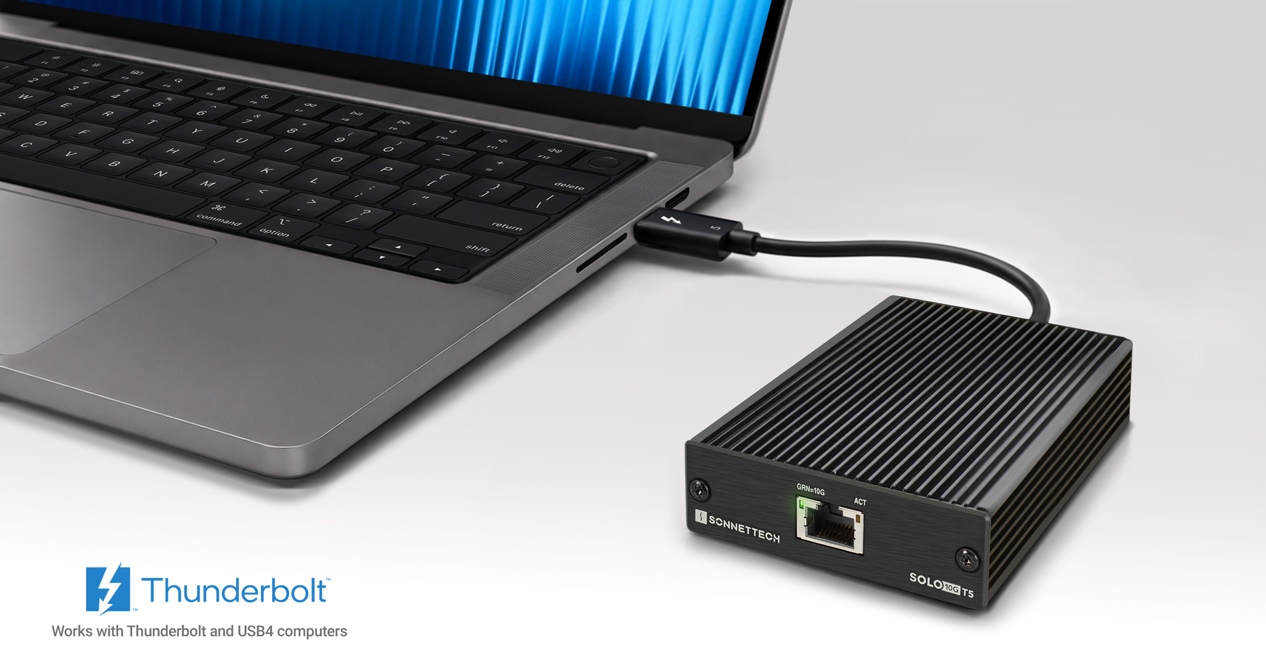 Solo10G T5 Thunderbolt 5 Adapter connected to MacBook Pro.