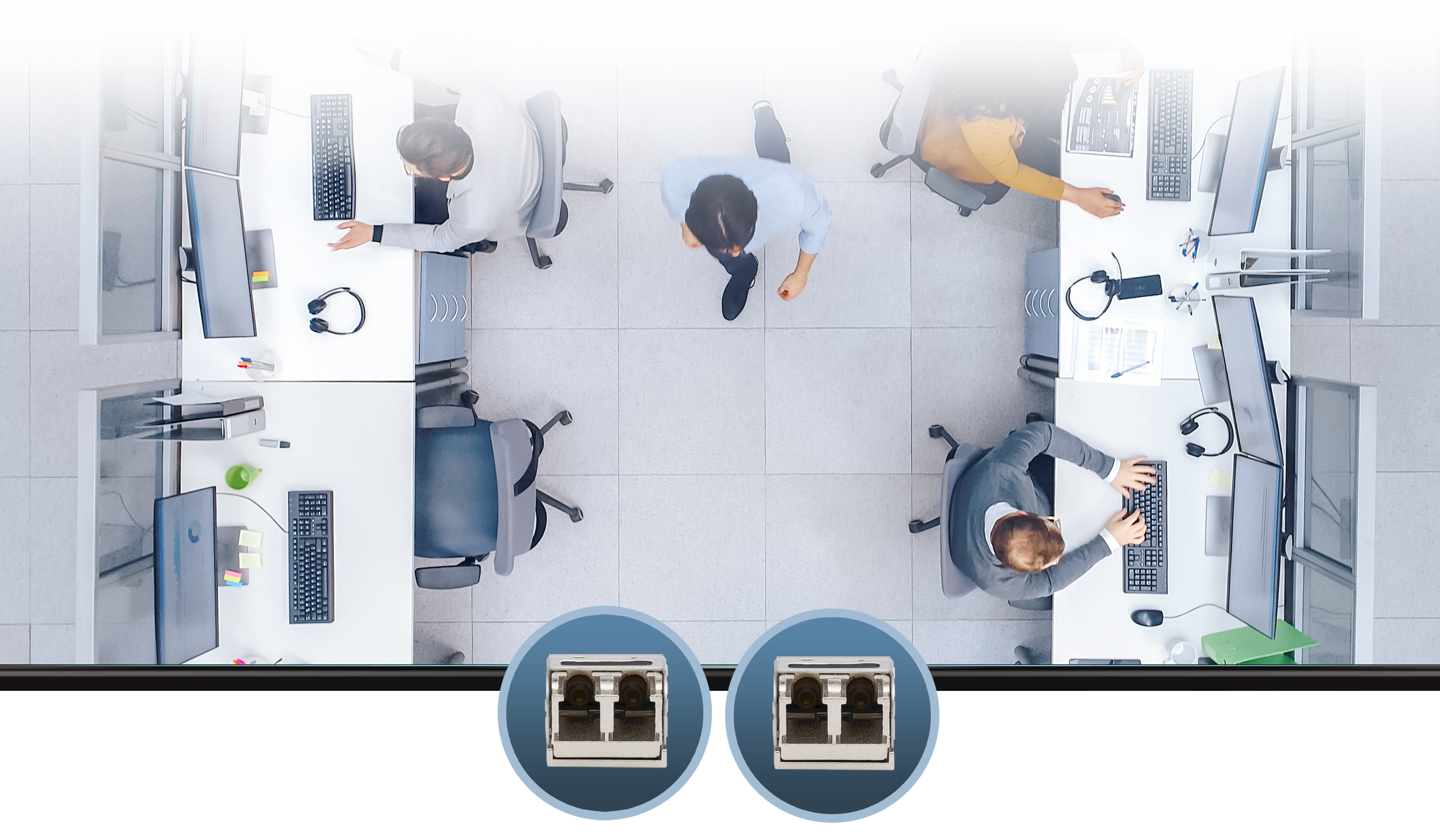Women Sitting Behind Computer System in Office Setting